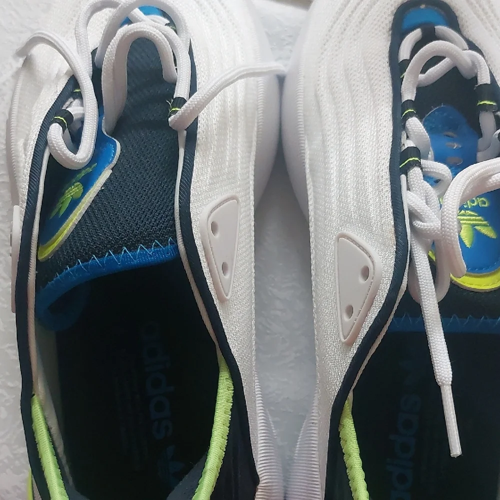 Adidas Adifom SLTN shoes in the Cloud White / SolarYellow / Blue Colorway